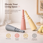 Three matte vases in pink, beige, and gray on a light surface with text describing their features.