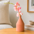 Elegant classic ceramic flower vase with red flowers for modern home décor