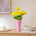 Sky Pink ribbed ceramic flower vase with yellow flowers for modern luxury home décor and contemporary interior styling in India