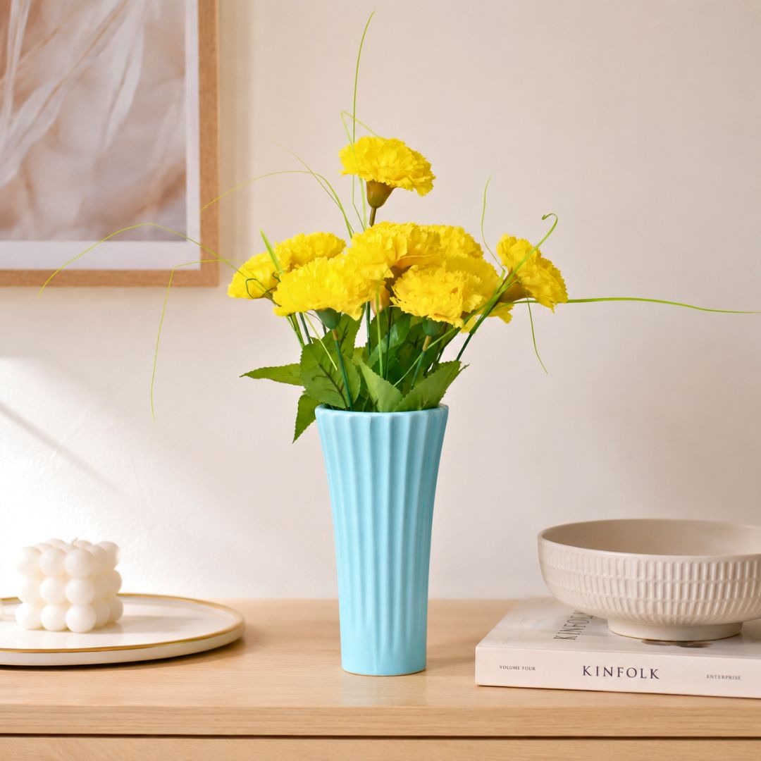 Sky blue ribbed ceramic flower vase with yellow flowers for modern luxury home décor and contemporary interior styling in India