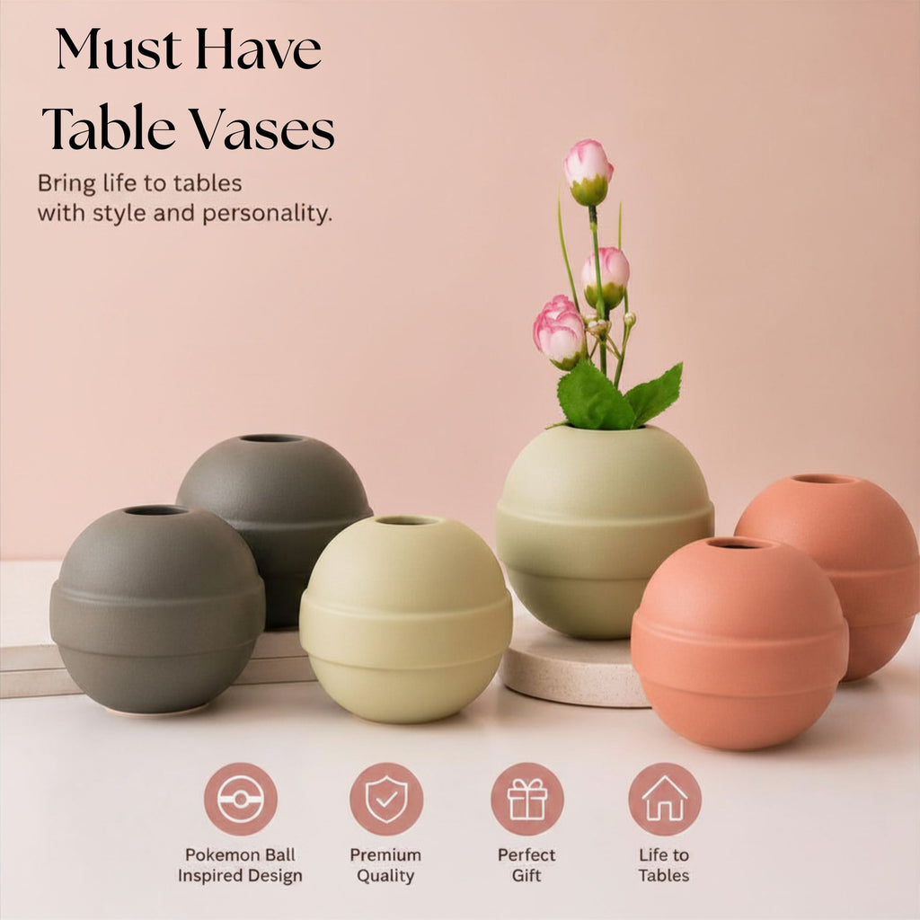 Modern ceramic Pokémon ball vase with baby breath flowers on wooden desk in aesthetic home interior