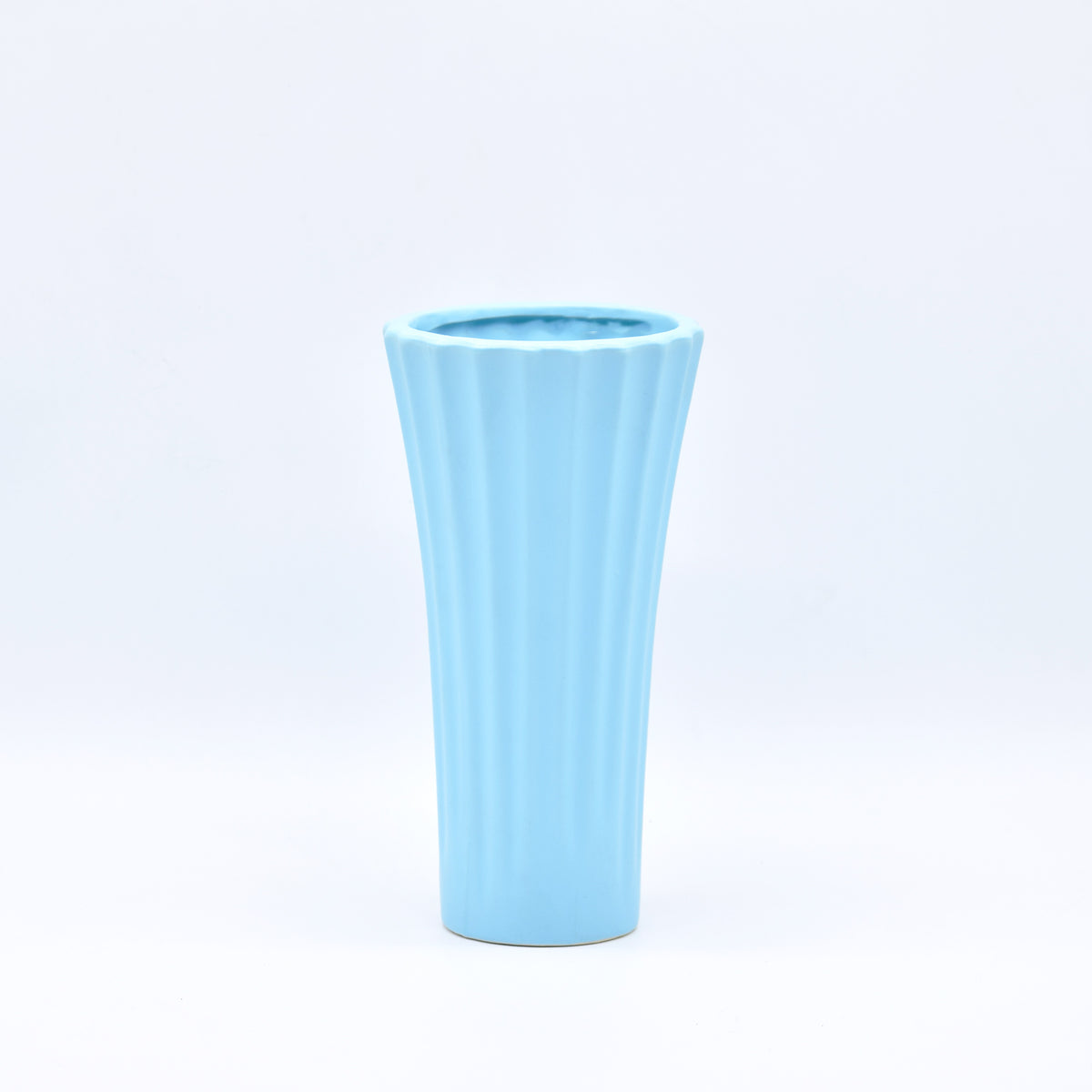 Sky blue ribbed ceramic flower vase with yellow flowers for modern luxury home décor and contemporary interior styling in India