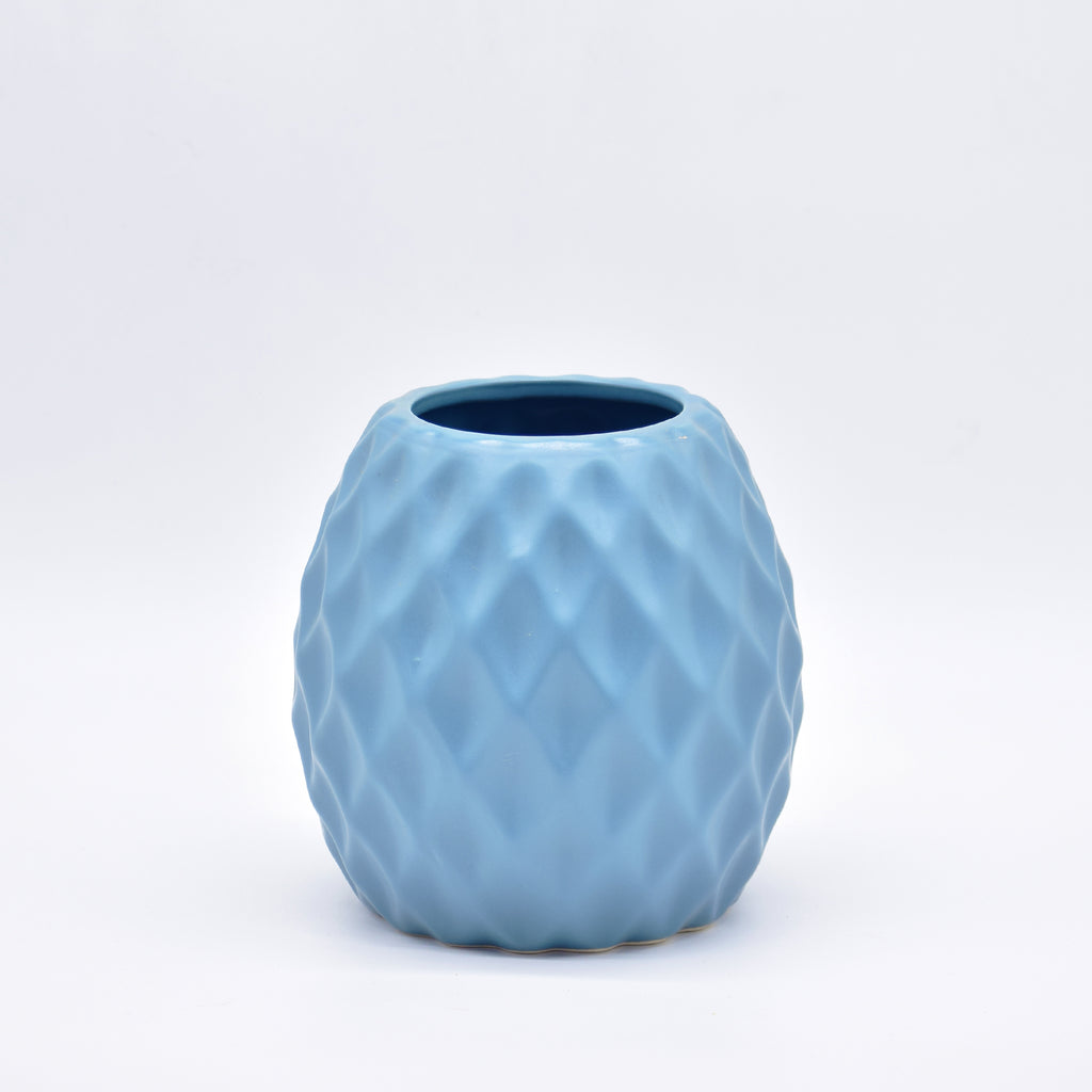 Delilah Cross modern ceramic vase with matte finish styled for luxury home décor with dried flowers in Indian interior setting