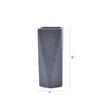 Modern geometric ceramic flower vase with yellow floral arrangement for luxury contemporary Indian home décor