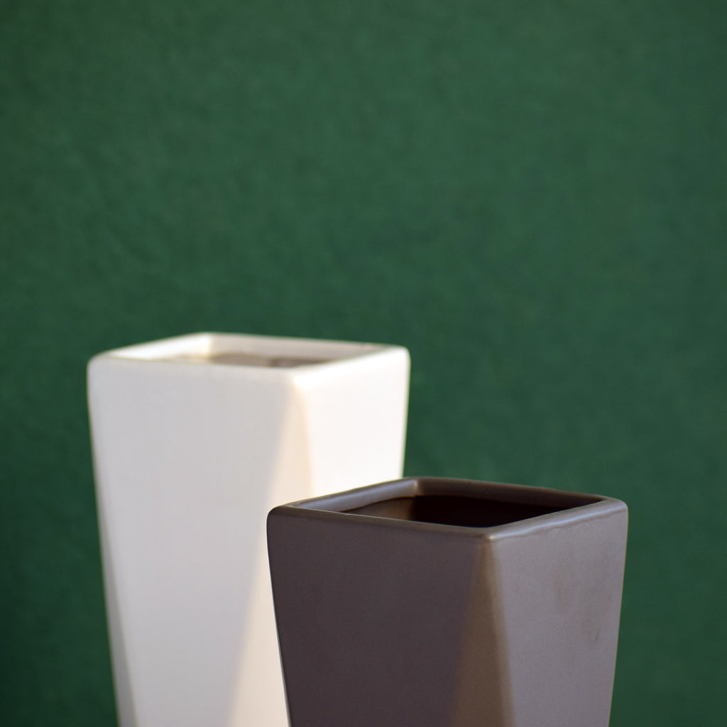Modern geometric ceramic flower vase with yellow floral arrangement for luxury contemporary Indian home décor