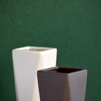 Modern geometric ceramic flower vase with yellow floral arrangement for luxury contemporary Indian home décor
