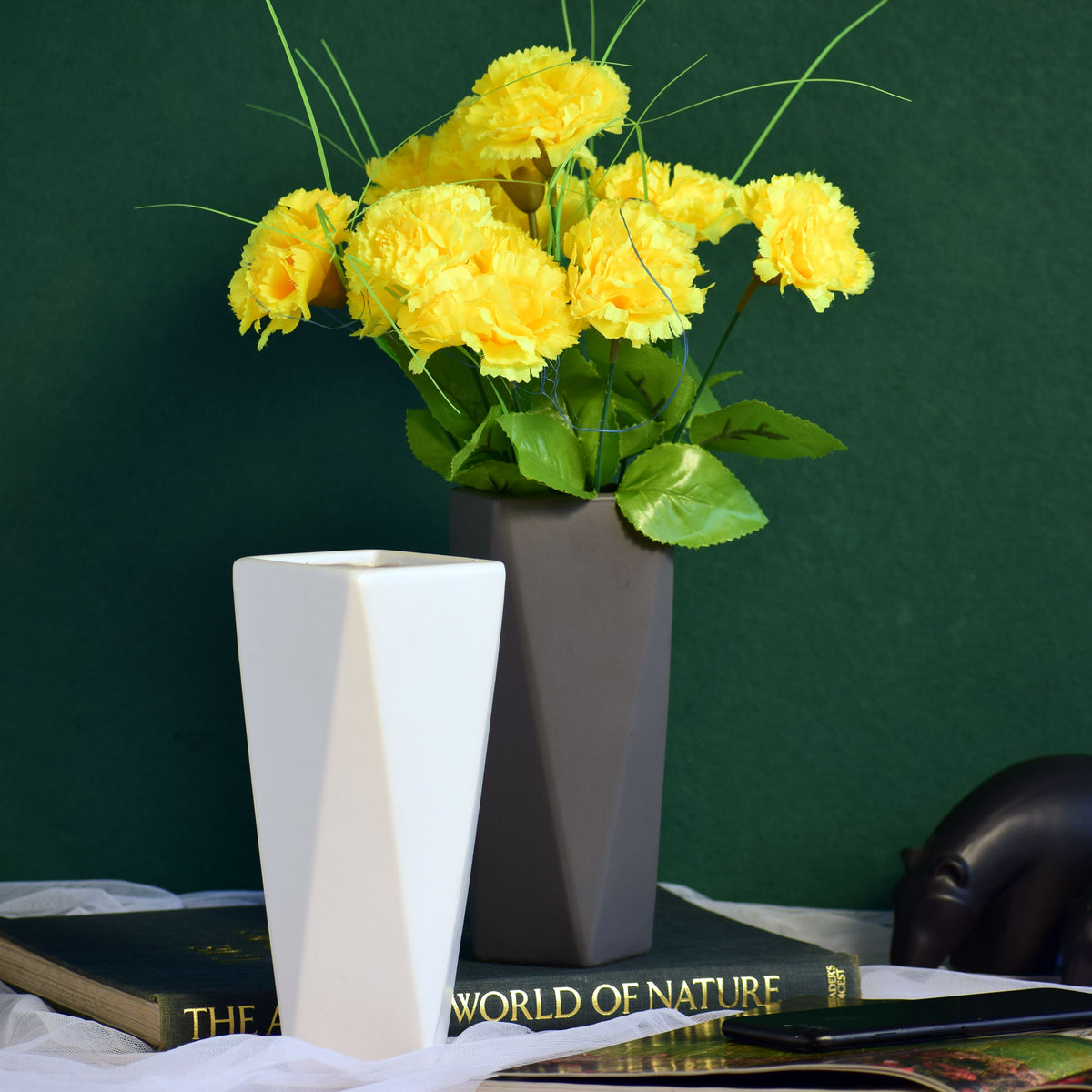 Modern geometric ceramic flower vase with yellow floral arrangement for luxury contemporary Indian home décor