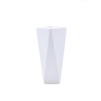 Modern geometric ceramic flower vase with yellow floral arrangement for luxury contemporary Indian home décor