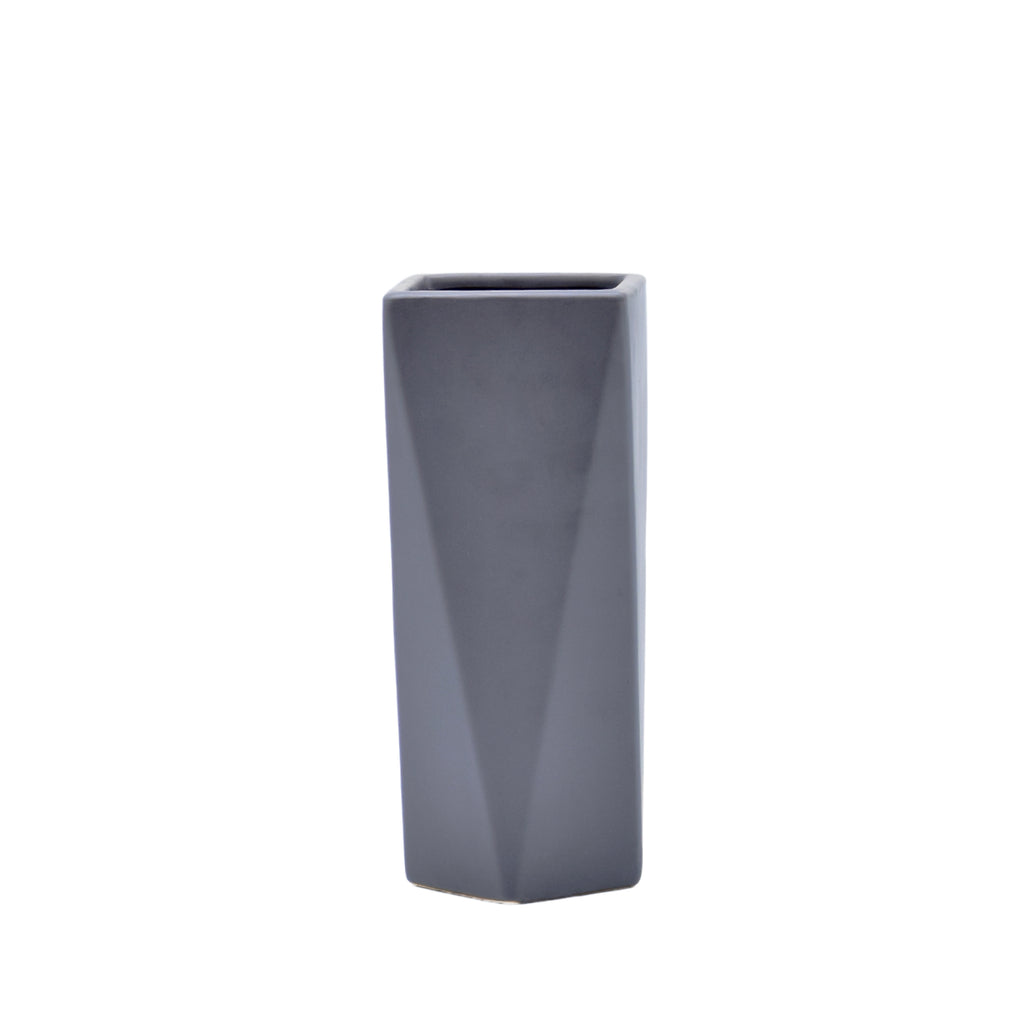 Modern geometric ceramic flower vase with yellow floral arrangement for luxury contemporary Indian home décor