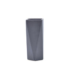 Modern geometric ceramic flower vase with yellow floral arrangement for luxury contemporary Indian home décor