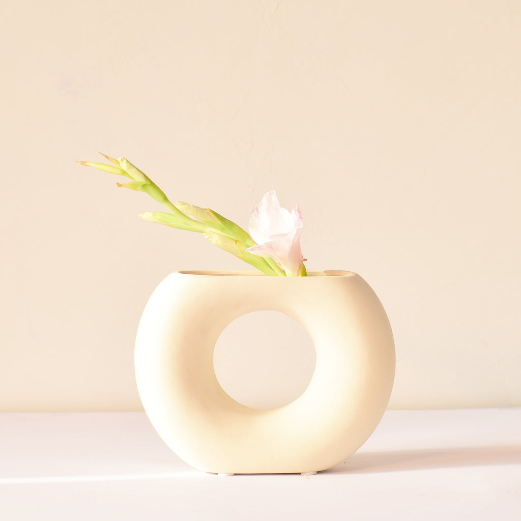 Morcee Half Donut Decorative Vase crafted from premium ceramic, styled in a modern luxury living room interior with contemporary home décor.