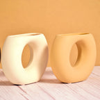 Morcee Half Donut Decorative Vase crafted from premium ceramic, styled in a modern luxury living room interior with contemporary home décor.