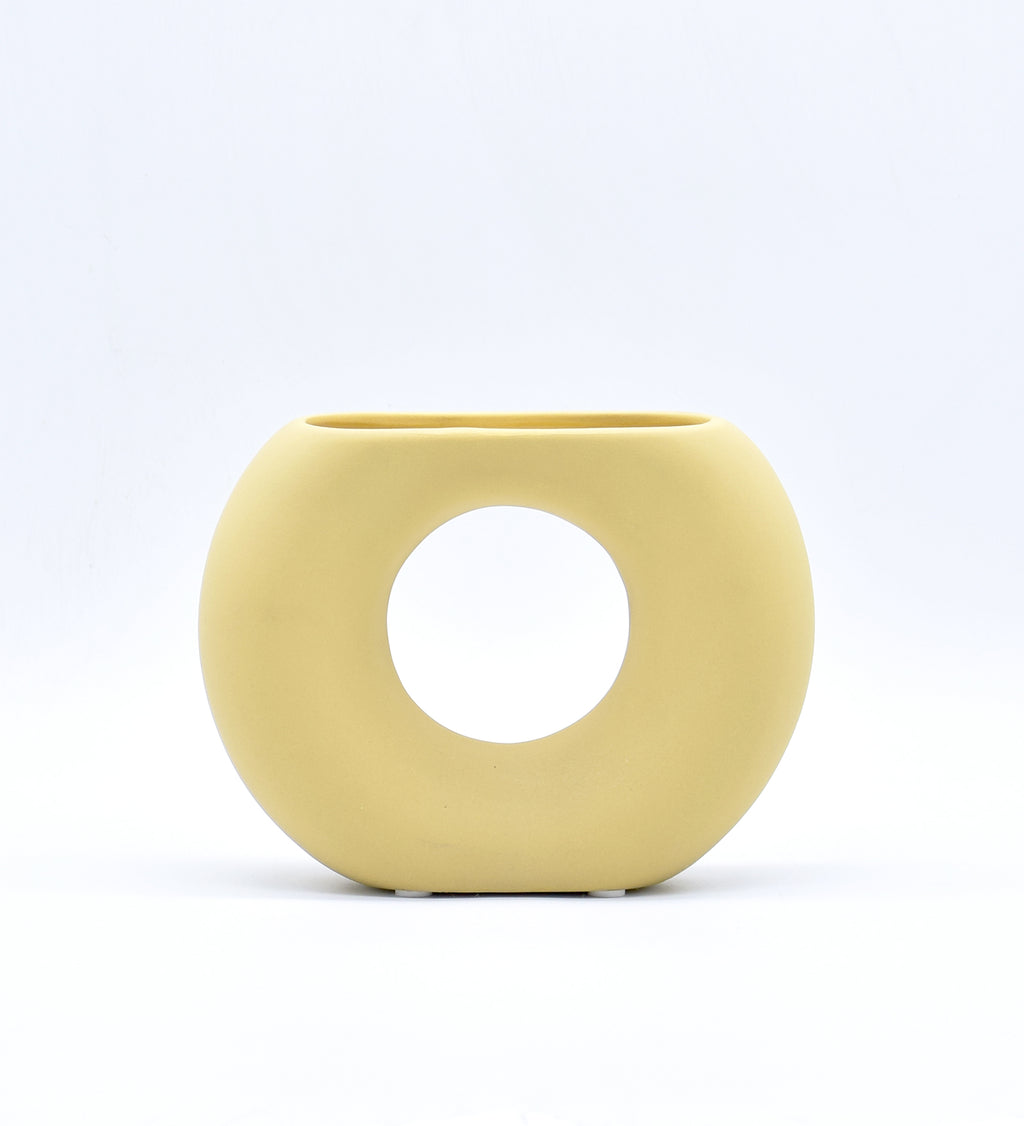 Morcee Half Donut Decorative Vase crafted from premium ceramic, styled in a modern luxury living room interior with contemporary home décor.