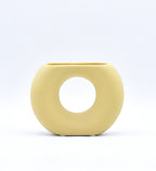 Morcee Half Donut Decorative Vase crafted from premium ceramic, styled in a modern luxury living room interior with contemporary home décor.
