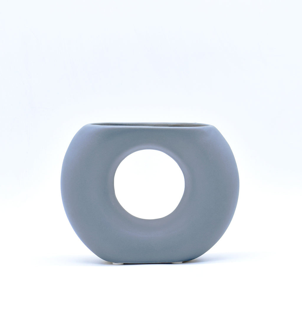 Morcee Half Donut Decorative Vase crafted from premium ceramic, styled in a modern luxury living room interior with contemporary home décor.