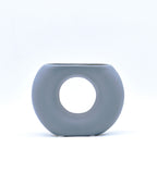 Morcee Half Donut Decorative Vase crafted from premium ceramic, styled in a modern luxury living room interior with contemporary home décor.