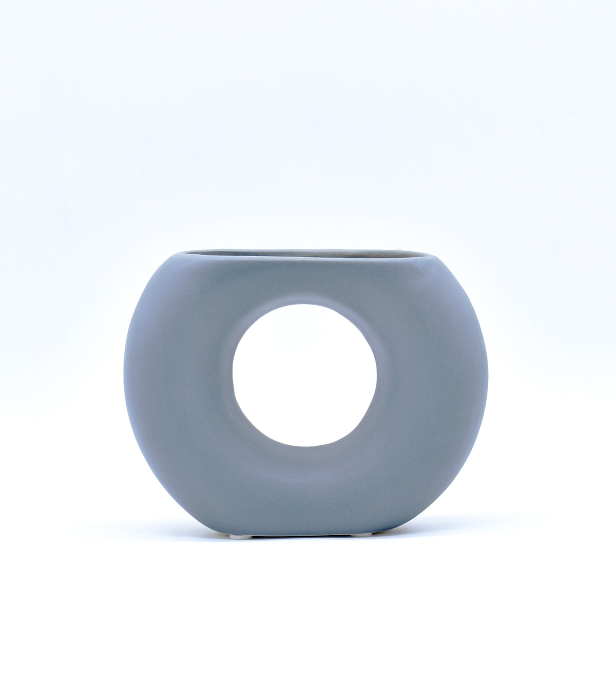 Morcee Half Donut Decorative Vase crafted from premium ceramic, styled in a modern luxury living room interior with contemporary home décor.