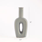 Modern hollow linear ceramic flower vase styled with pampas grass in a minimalist Indian living room interior décor setup