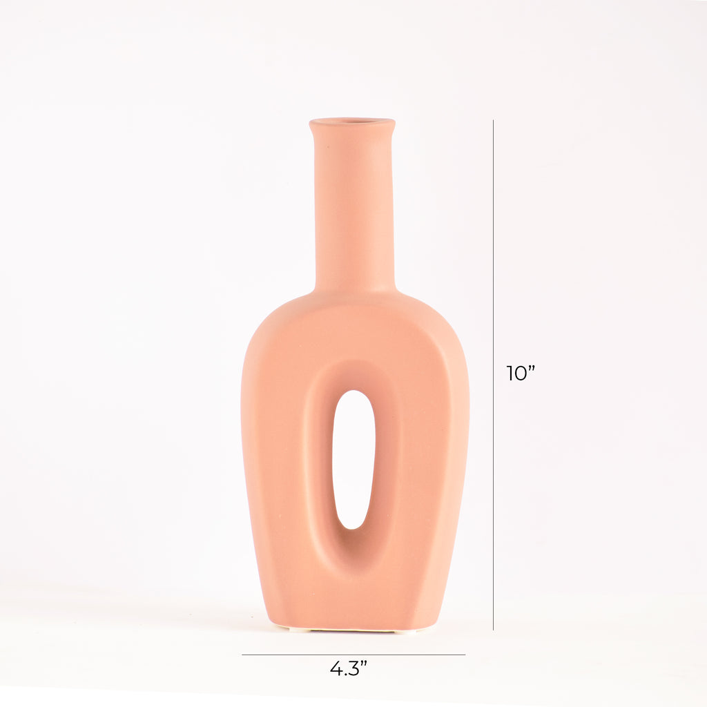 Modern hollow linear ceramic flower vase styled with pampas grass in a minimalist Indian living room interior décor setup