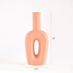 Modern hollow linear ceramic flower vase styled with pampas grass in a minimalist Indian living room interior décor setup
