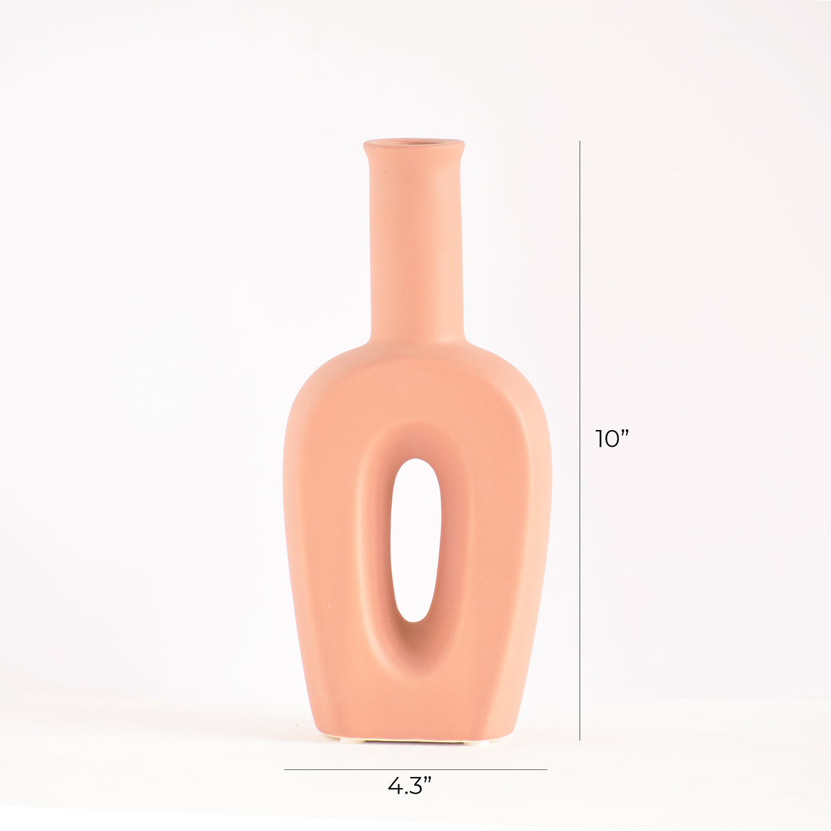 Modern hollow linear ceramic flower vase styled with pampas grass in a minimalist Indian living room interior décor setup
