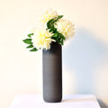 Luxury modern ceramic flower vase styled in a contemporary living room with elegant home décor, minimalist interiors, and premium decorative accents.