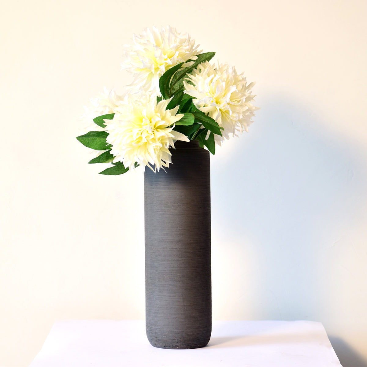 Luxury modern ceramic flower vase styled in a contemporary living room with elegant home décor, minimalist interiors, and premium decorative accents.