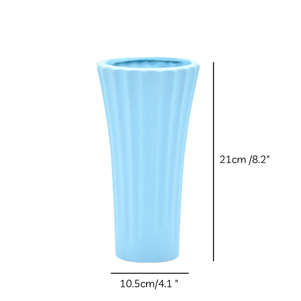 Sky blue ribbed ceramic flower vase with yellow flowers for modern luxury home décor and contemporary interior styling in India
