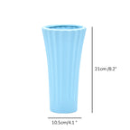 Sky blue ribbed ceramic flower vase with yellow flowers for modern luxury home décor and contemporary interior styling in India