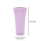 Sky blue ribbed ceramic flower vase with yellow flowers for modern luxury home décor and contemporary interior styling in India