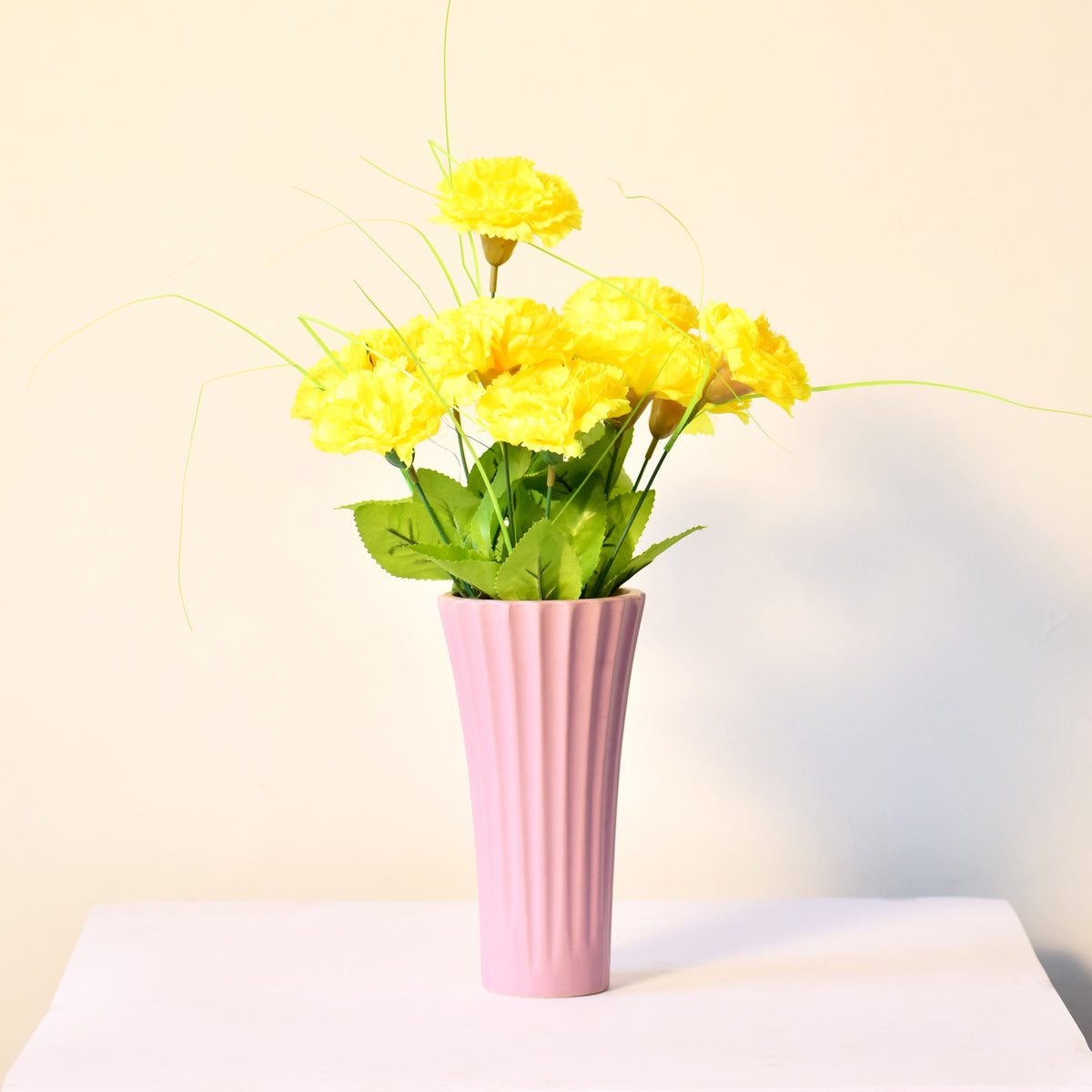 Sky blue ribbed ceramic flower vase with yellow flowers for modern luxury home décor and contemporary interior styling in India