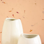 Neck WhitaLuxury ceramic vase set with elegant floral styling displayed in a modern contemporary living room with premium home décor accents.e Vase 