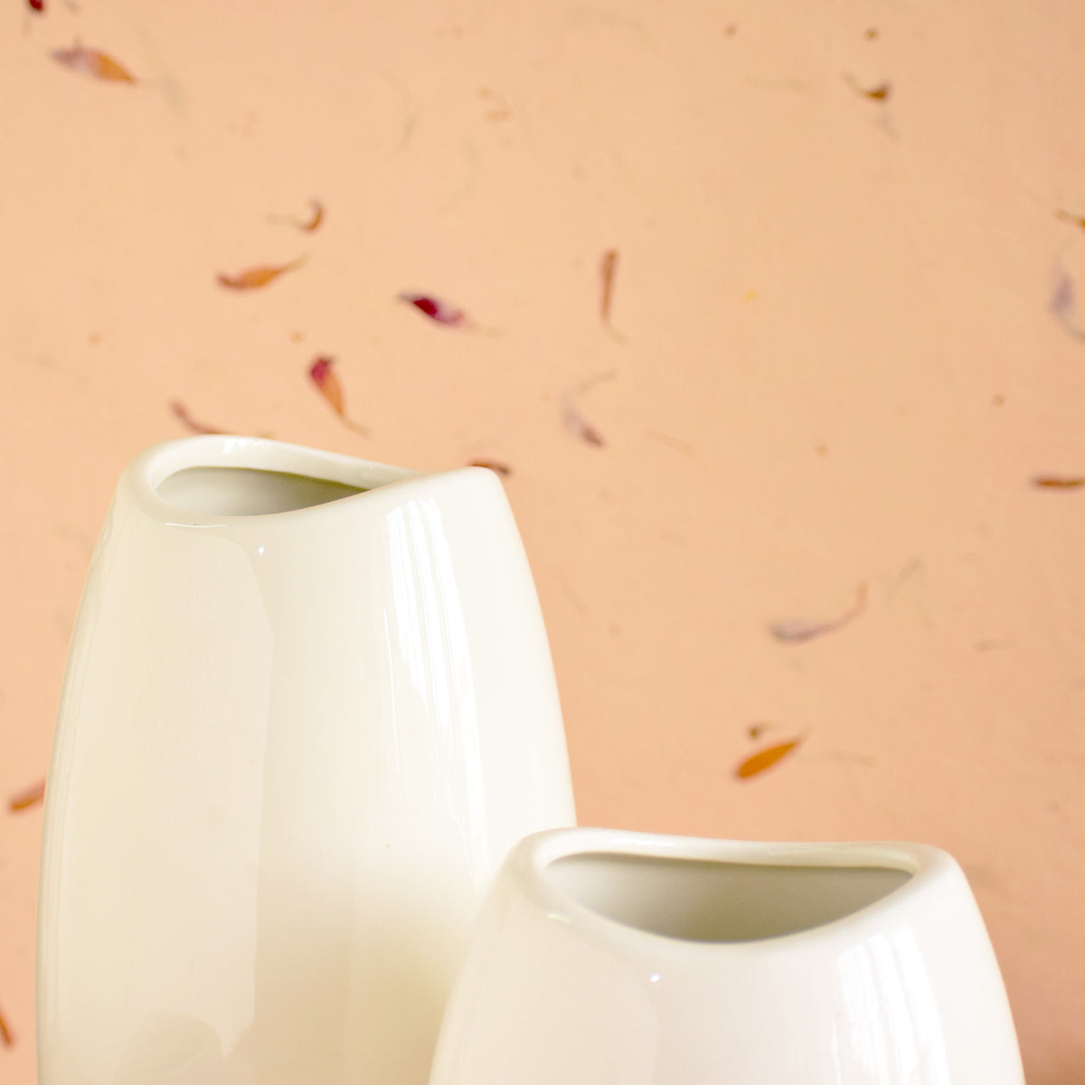 Neck WhitaLuxury ceramic vase set with elegant floral styling displayed in a modern contemporary living room with premium home décor accents.e Vase 