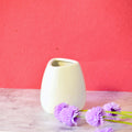 Luxury ceramic vase set with elegant floral styling displayed in a modern contemporary living room with premium home décor accents.