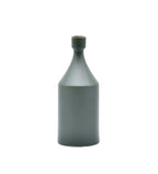 Luxury ceramic bottle-shaped vase with matte finish styled on a beige travertine console table in a modern Scandinavian-inspired interior with olive branches and minimalist décor.