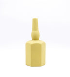 Luxury ceramic bottle-shaped vase with matte finish styled on a beige travertine console table in a modern Scandinavian-inspired interior with olive branches and minimalist décor.