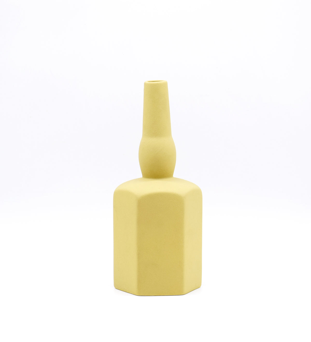 Luxury ceramic bottle-shaped vase with matte finish styled on a beige travertine console table in a modern Scandinavian-inspired interior with olive branches and minimalist décor.