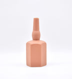 Luxury ceramic bottle-shaped vase with matte finish styled on a beige travertine console table in a modern Scandinavian-inspired interior with olive branches and minimalist décor.